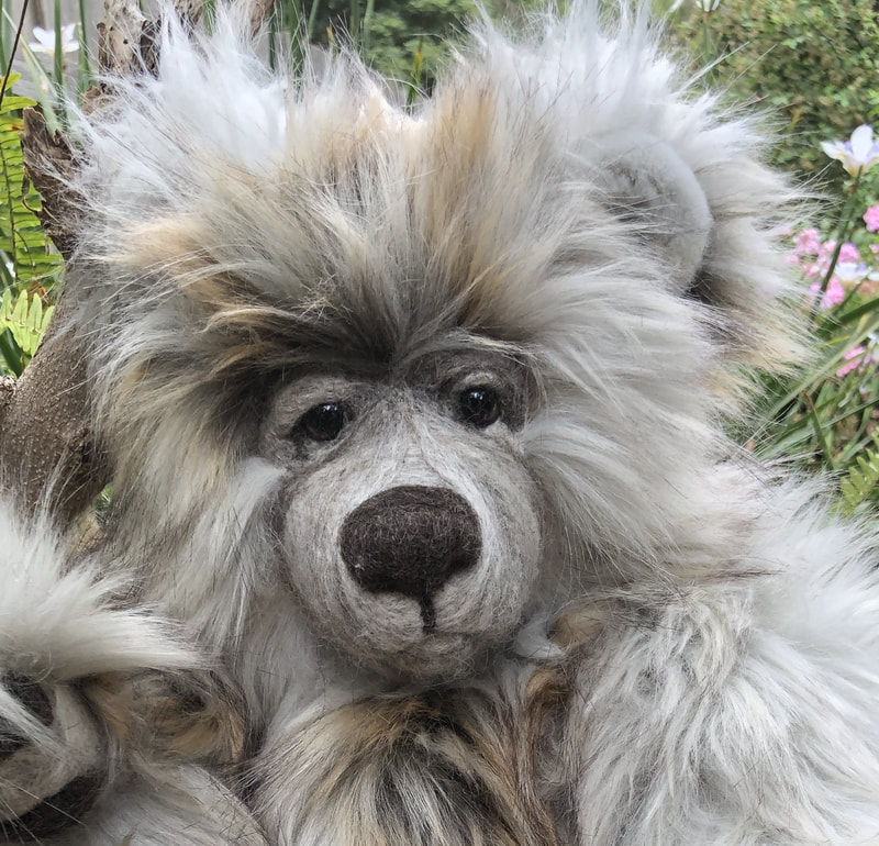 Grey and brown fluffy teddy bear with a wise old man expression. Link Browse Teddy Bears